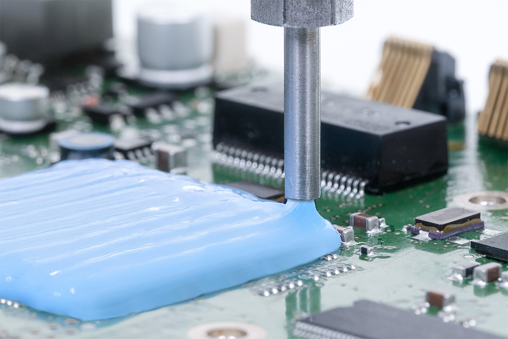 A Wevo silicone coating being applied to a printed circuit board.
